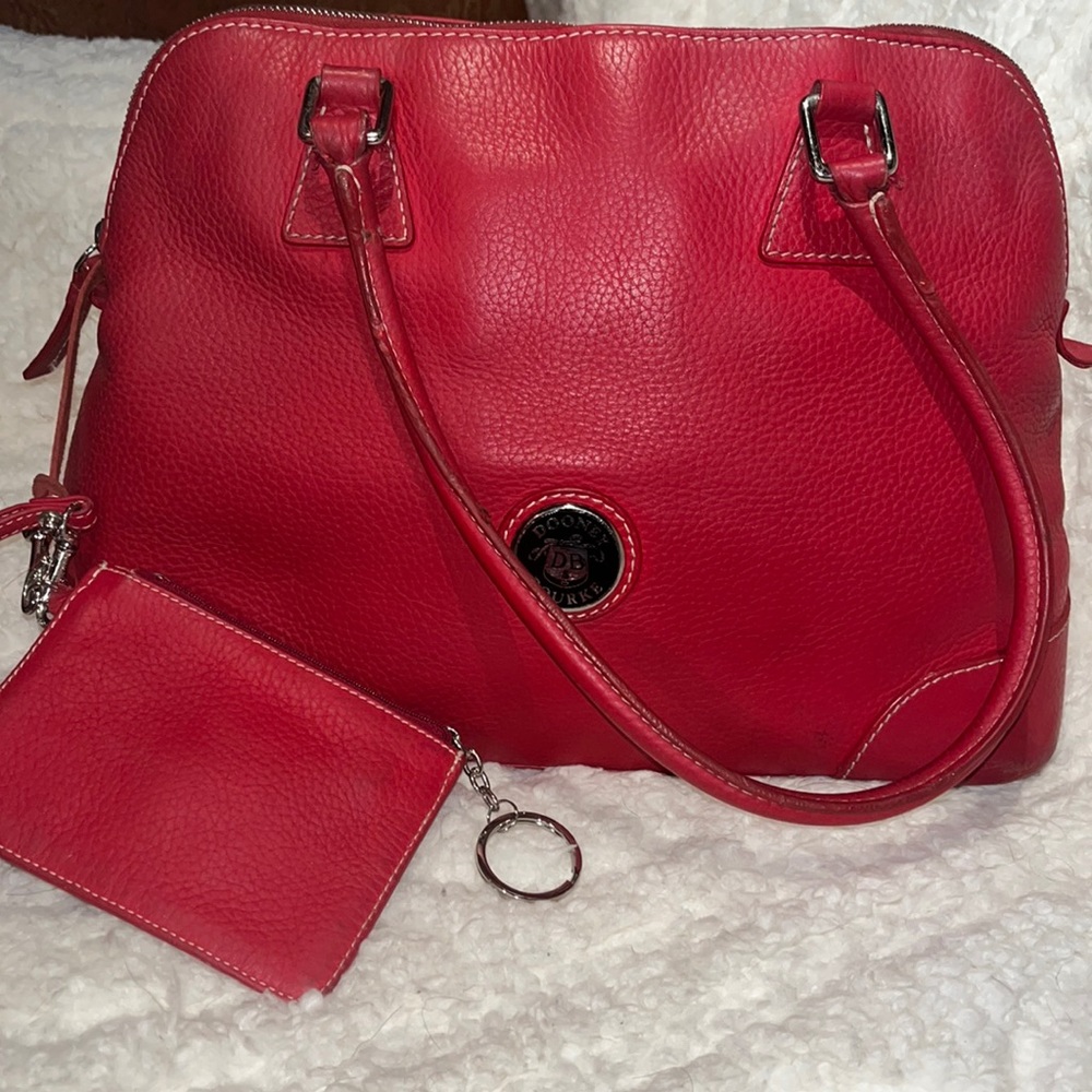 Large, vintage, red, all leather Dooney and Bourke comes with a wristlet
